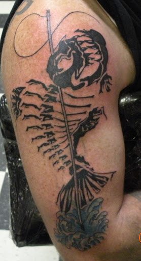 Explore cute dinosaur tattoo ideas, creative tattoo ideas in Powell, available at AVALON COVE TATTOO