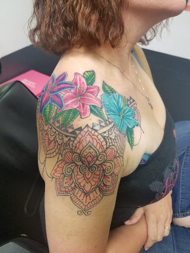 Find small tattoo between breast ideas for your next unique tattoo in Milledgeville at Pair-O-Dice