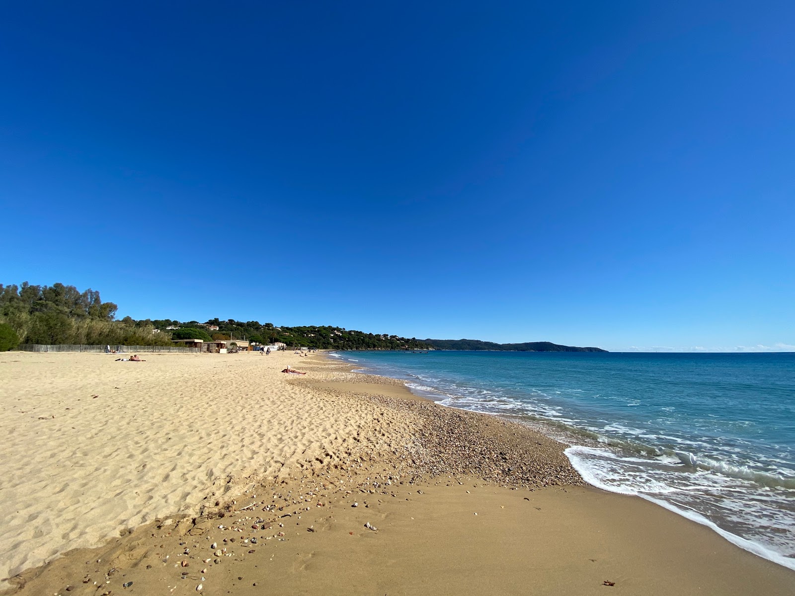Foto di Spiaggia di Debarquement con baia lunga