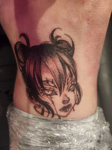 Explore carnage tattoo ideas, creative tattoo ideas in Corning, available at Manifest Studios