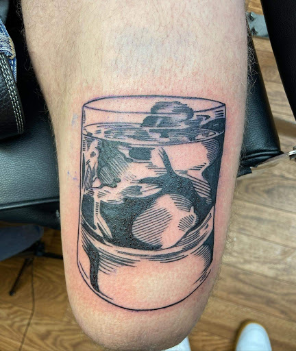 Explore wolf neck tattoo ideas, creative tattoo ideas in Shelbyville, available at Stage Left Tattoo and Piercing