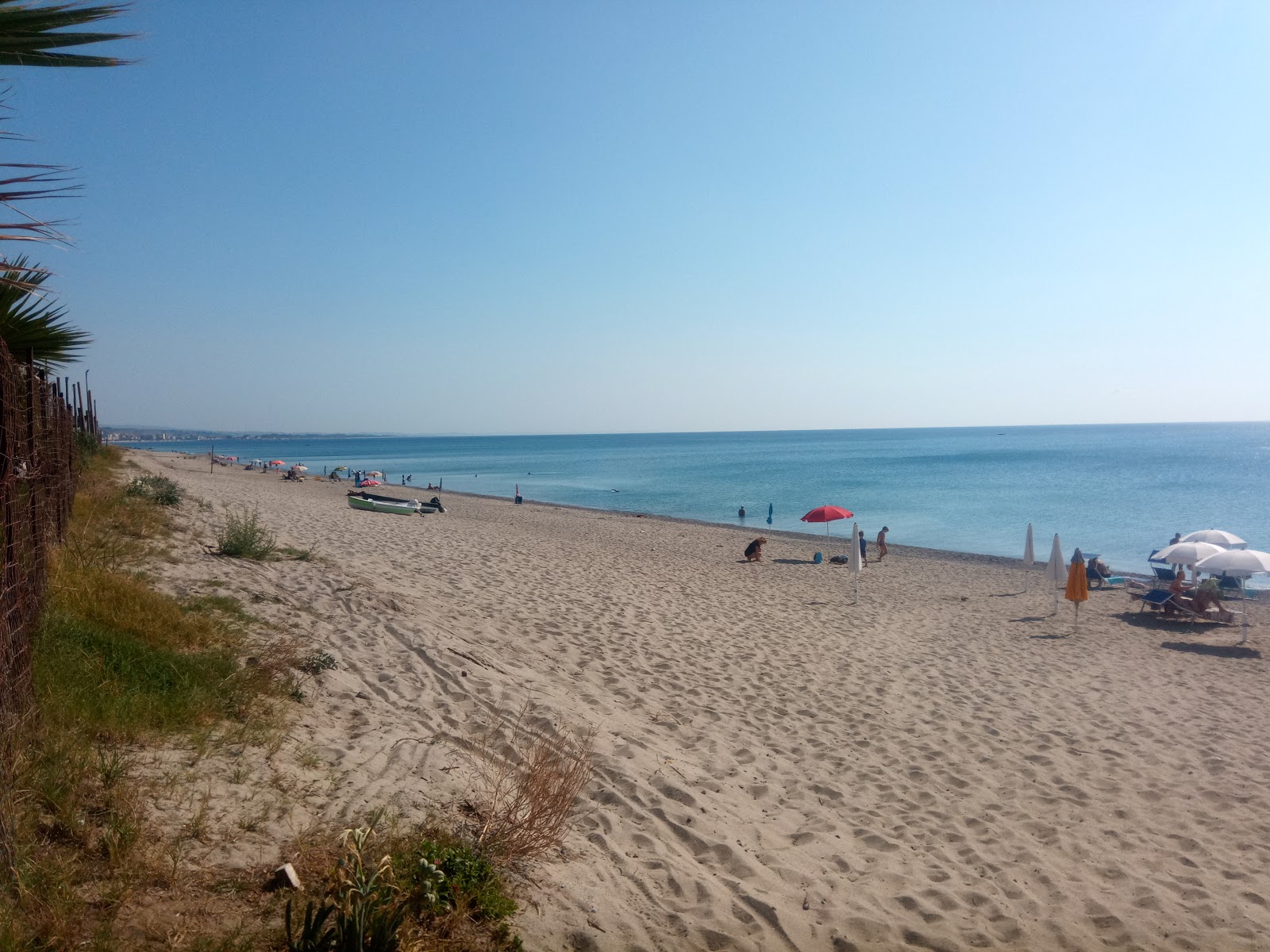 Villaggio le Roccelle beach'in fotoğrafı parlak kum yüzey ile
