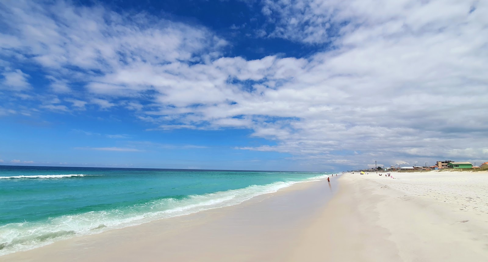 Fotografija Praia de Figueira z beli fini pesek površino