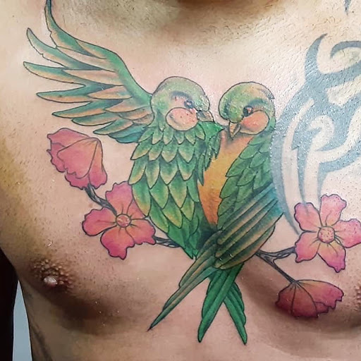 Explore kaws tattoo ideas, creative tattoo ideas in Louisburg, available at Lewter Tattoos and Piercing