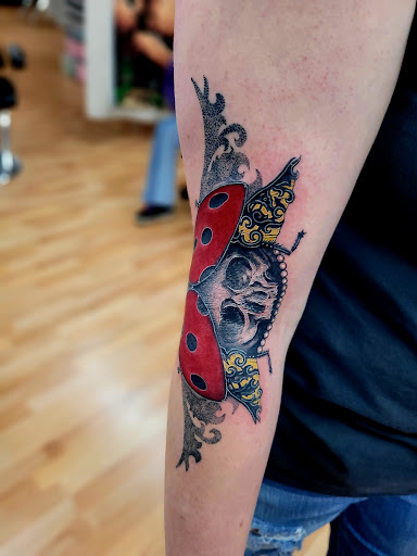 Explore tattoo on finger ideas, creative tattoo ideas in Benton, available at Spectrum Tattoo