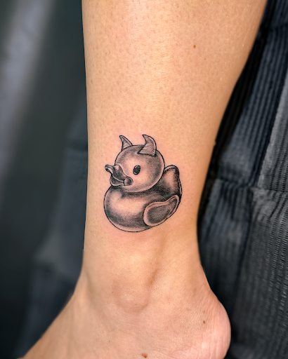 Explore dark skin male black skin tattoo ideas, creative tattoo ideas in Charlotte, available at Olive Branch Tattoo Studio