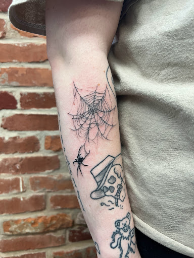 Explore tattoo ideas for women's lower back, creative tattoo ideas in Leola, available at Sweet Omens