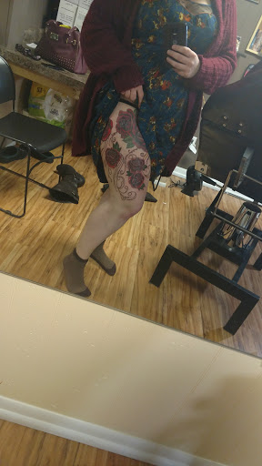 Find christmas tattoo ideas for your next unique tattoo in Owosso at Expressions Body Art Studio