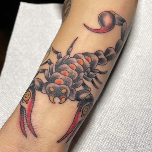 Explore middle neck tattoo ideas, creative tattoo ideas in Edgewood, available at Wild Coyote Tattoo