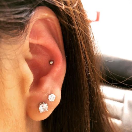 Explore tattoo ideas behind the ear tattoos, creative tattoo ideas in Charleston, available at Exotic Impressions Body Piercing