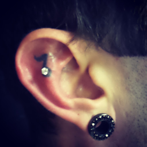 Explore religious tattoo ideas, creative tattoo ideas in Conway, available at Primal Urge Tattoos