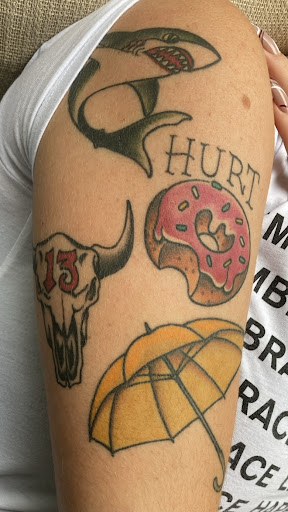Explore thigh tattoo ideas for females, creative tattoo ideas in Wakefield, available at Wakefield Tattoo