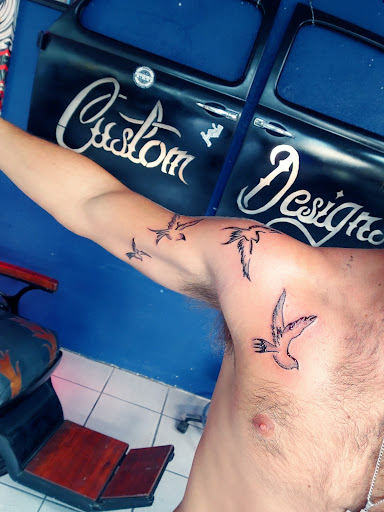 Explore moto tattoo ideas, creative tattoo ideas in Brandon, available at Pinup Tattoo Studio