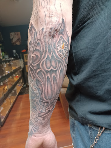 Explore tattoo hand ideas, creative tattoo ideas in Shippensburg, available at LAZY WIZARD TATTOOS