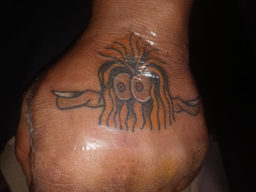 Explore curious george tattoo ideas, creative tattoo ideas in North Little Rock, available at The Parlor Tattoo