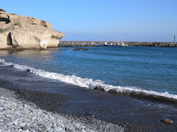 Foto von Playa De Tajao und die siedlung