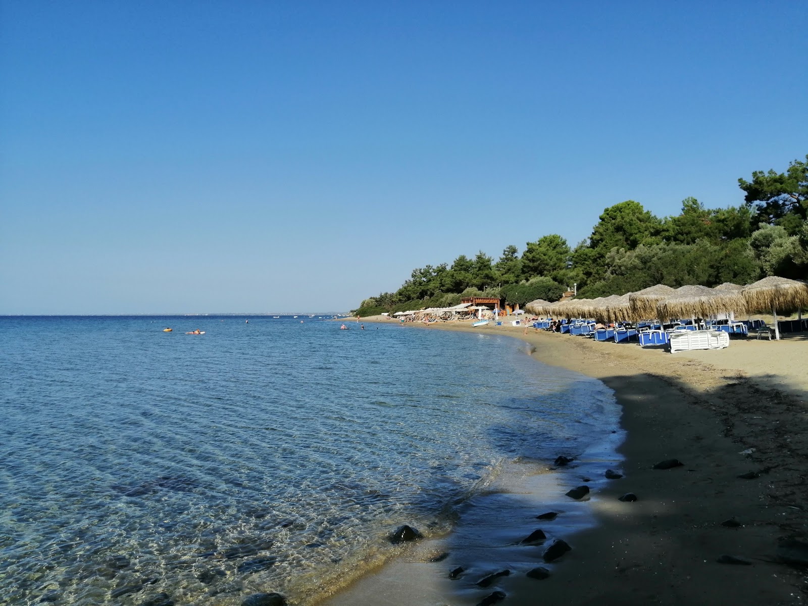 Fotografie cu Gerakini beach II cu o suprafață de apa pură turcoaz