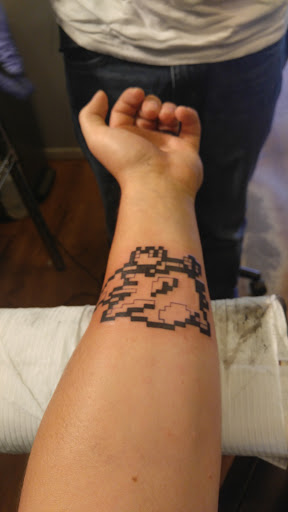 Tattoo Shop «Crimson Tattoos», reviews and photos, 106 W Main St, Owosso, MI 48867, USA