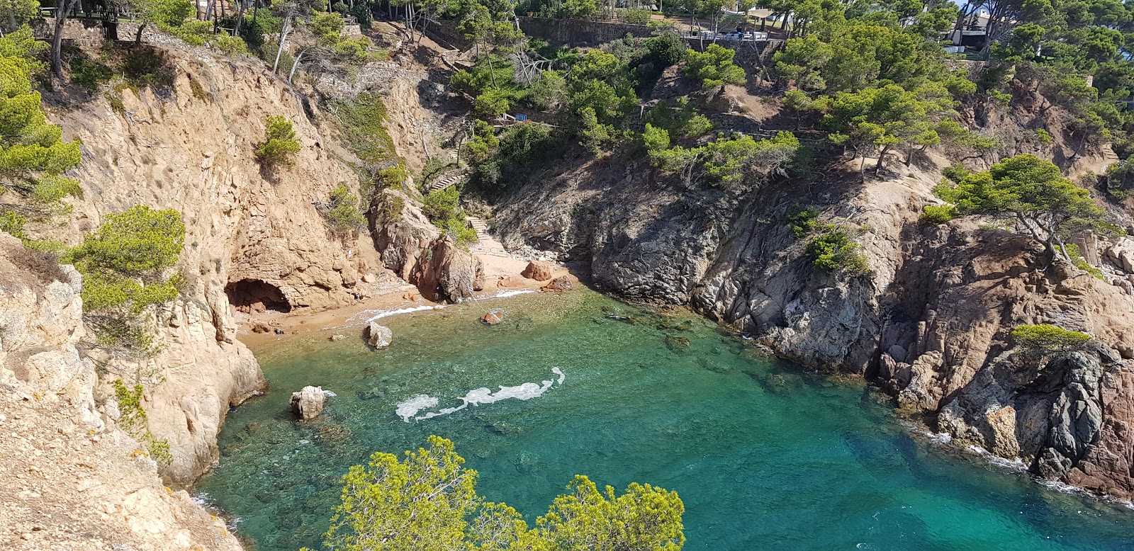 Photo of Cala dels Canyers with tiny bay