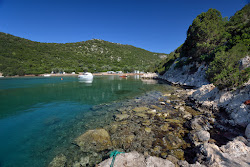 Foto von Marathias Beach und die siedlung