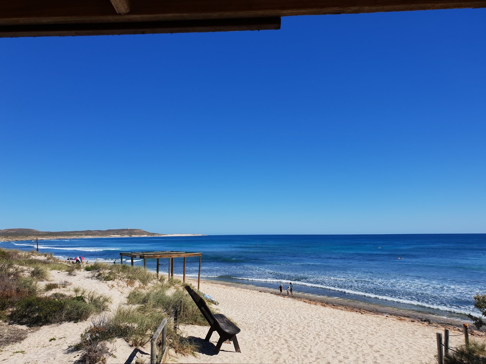Foto di Dunes Beach con una superficie del sabbia beige