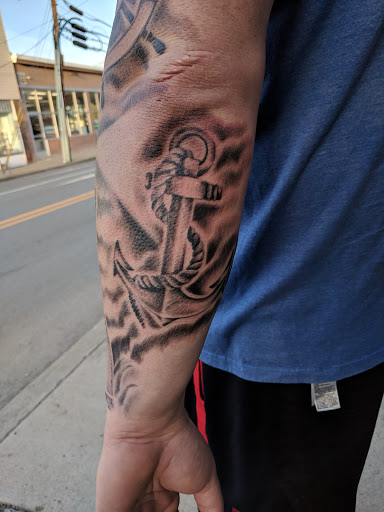 Explore men's clock tattoo ideas, creative tattoo ideas in Butler, available at The Ink Vault