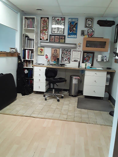 Explore tattoo ideas for arm, creative tattoo ideas in Buffalo, available at CowPok Piercing Tattoo Gallery