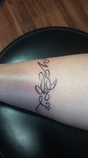 Explore cover up tattoos ideas forearm, creative tattoo ideas in Cheyenne, available at The T.R.I.B.E. Zoo, LLC Tattoo