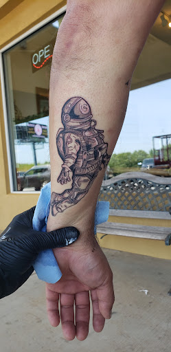 Explore fish hook tattoo ideas, creative tattoo ideas in Cornelia, available at Prismatic Pulse Tattoo