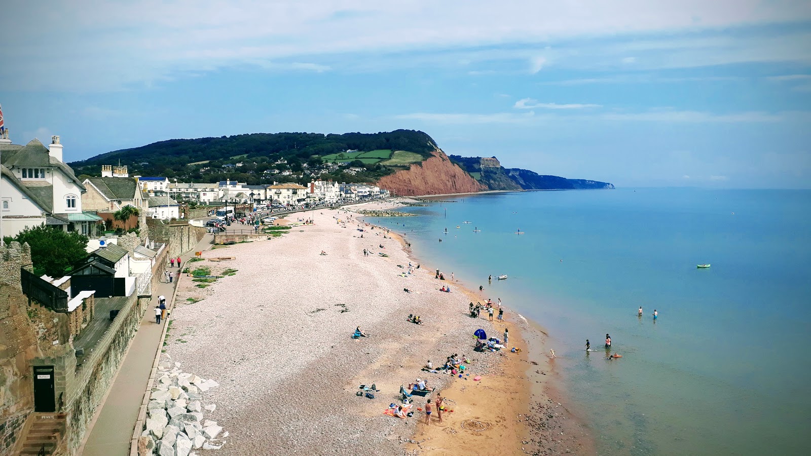 Foto af Sidmouth Strand med gråt sand og småsten overflade