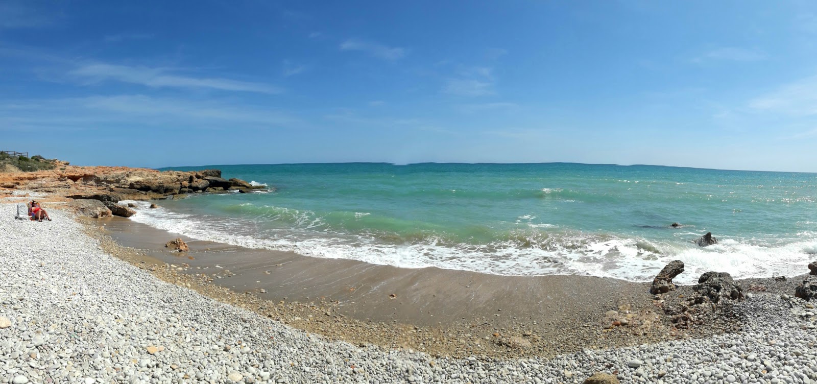 Fotografie cu Platja del Moro 2 cu o suprafață de nisip gri și pietricele