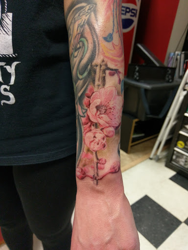 Explore butterfly sleeve tattoo ideas, creative tattoo ideas in Stevens Point, available at Mothers Approval Tattooing
