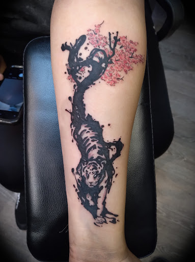 Explore campfire tattoo ideas, creative tattoo ideas in Johnson City, available at Defiant Designs