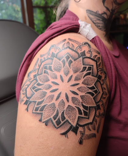 Explore solar eclipse tattoo ideas, creative tattoo ideas in Galena, available at Emerald Buddha Tattoo
