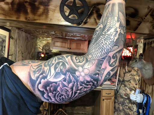 Explore whitetail deer tattoo ideas, creative tattoo ideas in Marietta, available at Lucky Draw Tattoos III