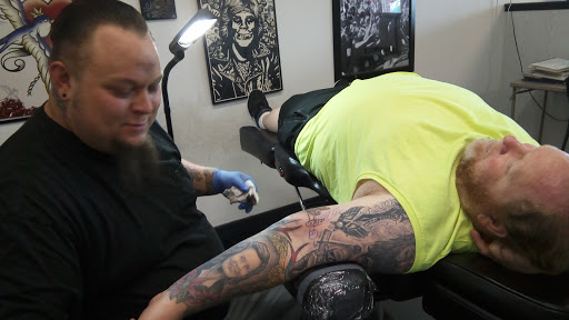 Explore first male tattoo ideas, creative tattoo ideas in Rogers, available at Jimmy Romance Tattoo & Body Piercing