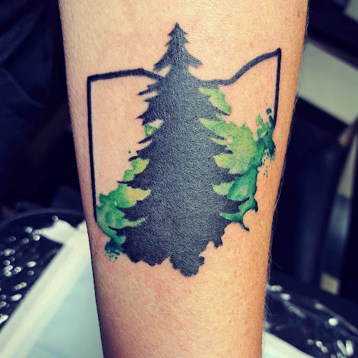 Explore tattoo ideas for women's lower back, creative tattoo ideas in Medina, available at Art In Motion Inc Tattooing