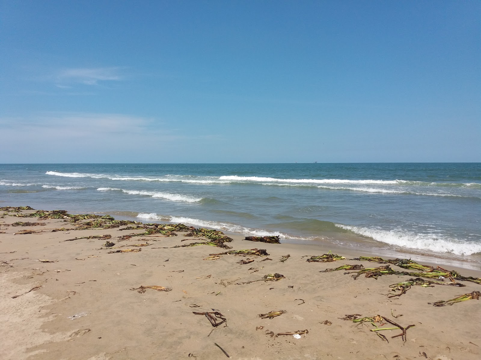 Valokuva Playa el Caracolista. pinnalla turkoosi vesi:n kanssa