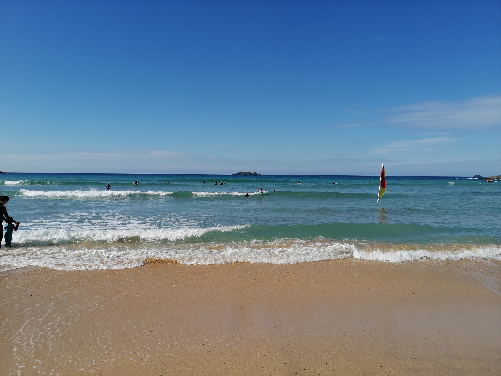 Photo of Harlyn Bay beach with turquoise pure water surface