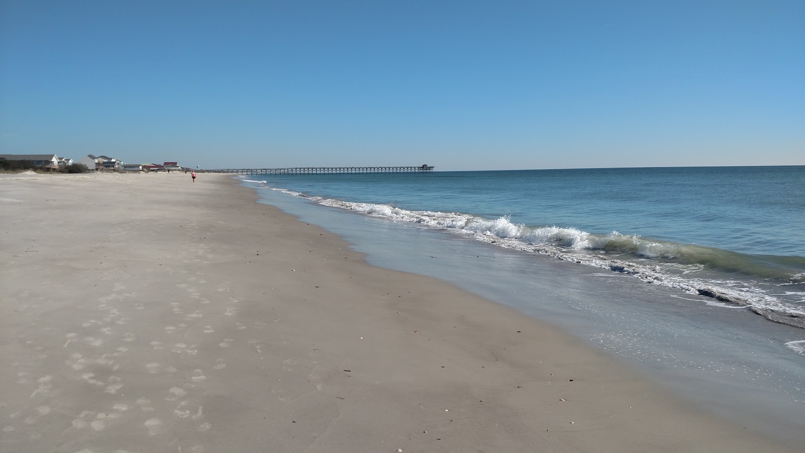 Photo of Long beach with long straight shore