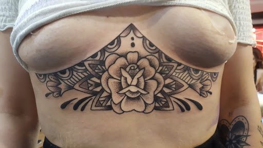 Explore carnage tattoo ideas, creative tattoo ideas in Reno, available at Aces Tattoo