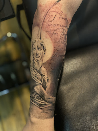 Explore curious george tattoo ideas, creative tattoo ideas in Oklahoma City, available at Muse Art Tattoo Company