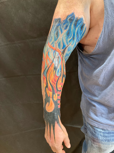 Explore male side tattoo ideas, creative tattoo ideas in Sarasota, available at SEVEN SINS Tattoo Studio