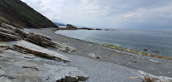 Foto von Playa de Penadoria umgeben von Bergen