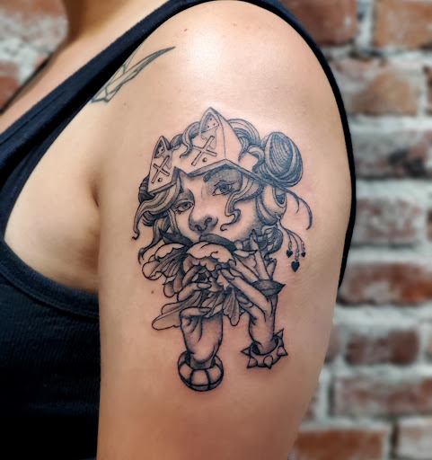 Explore indian feather tattoo ideas, creative tattoo ideas in Venice, available at KISS KISS TATTOO & PIERCING