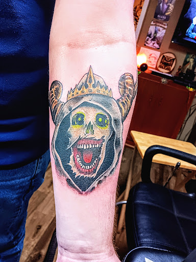 Explore back forearm tattoo ideas, creative tattoo ideas in Angola, available at SafeHouse Ink