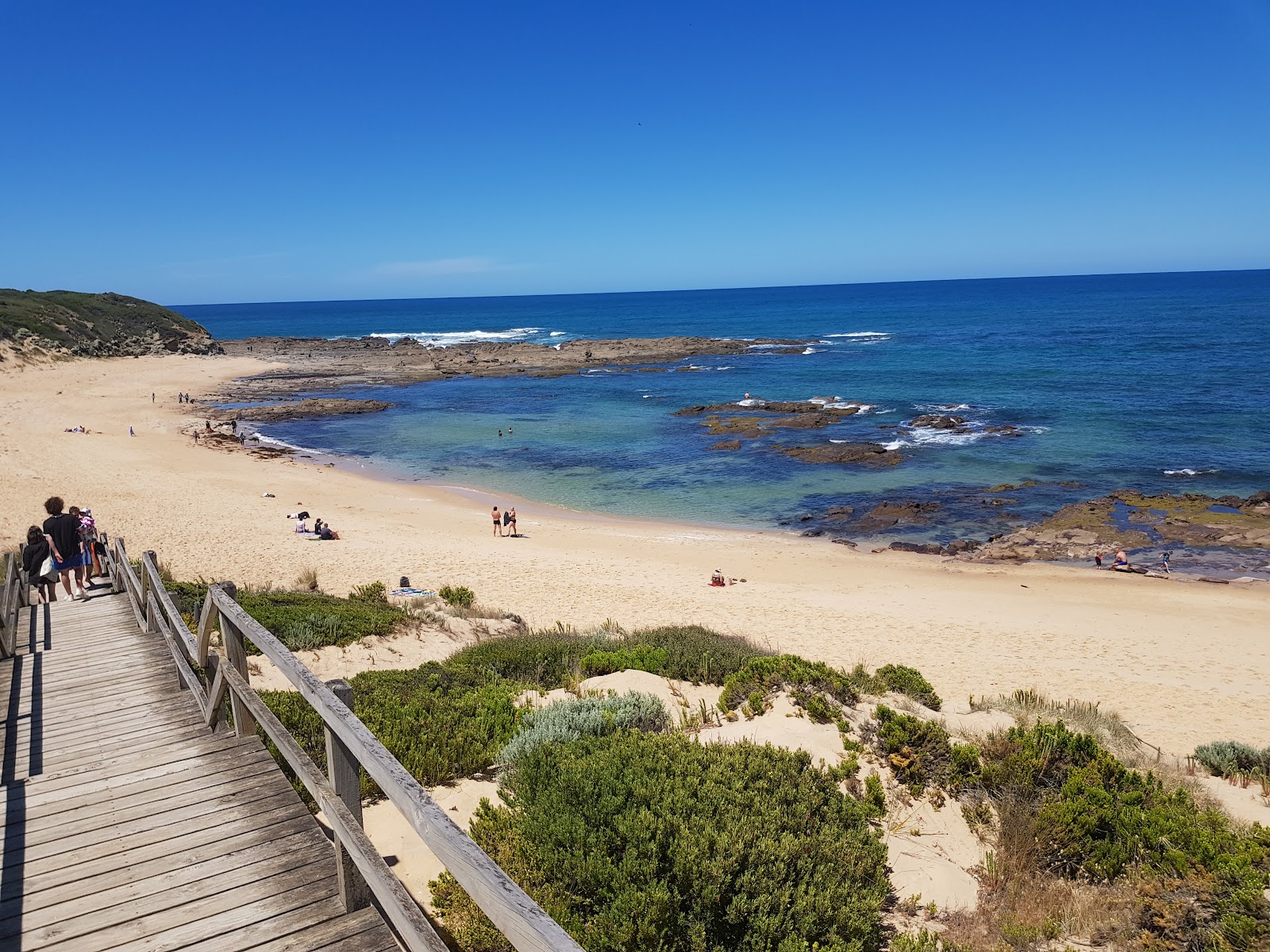 Foto van Kilcunda Beach met beige zand oppervlakte