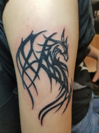 Explore up tattoo ideas, creative tattoo ideas in Lebanon, available at Erik Gwynns Beneath the Skin Tattooing & Piercing