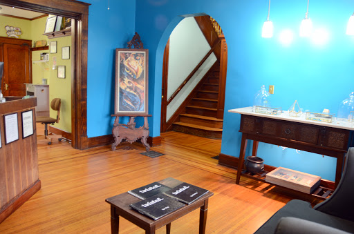 Explore back flower tattoo ideas, creative tattoo ideas in Louisville, available at Twisted Images