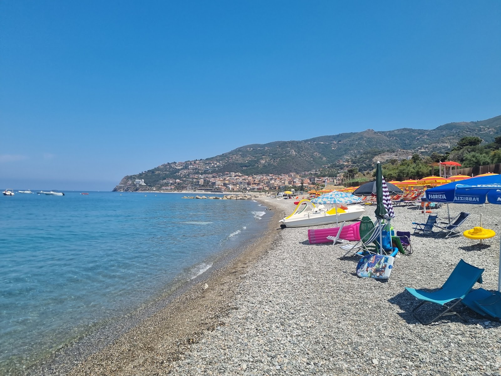 Foto av Lido Coral Beach med blå rent vatten yta